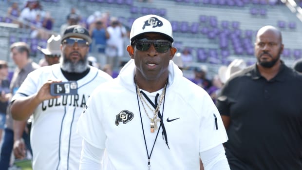 Colorado Buffaloes head coach Deon Sanders walks on the field before the game against the TCU Horned Frogs at Amon G. Carter Stadium